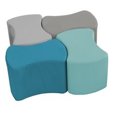 three different colored chairs sitting next to each other