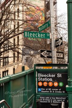 the street signs are clearly visible for everyone to see on this city's streets