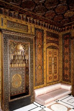 an ornately decorated room with two benches