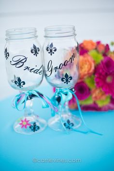 two mason jars with the words bride and groom painted on them