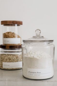 three jars filled with different types of food