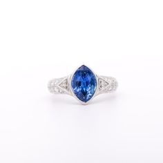 This is part of Chairish’s Fine Jewelry assortment.  GIA Certified Vintage Sapphire and Diamond Platinum Ring. Ideal as a man's pinky ring or a woman's statement/engagement ring.   This timeless ring features a marquise-cut blue Sapphire originating from Sri Lanka, it weighs 4 carats, and is of Sri Lanka (Ceylon) origin. It is paired with two cuts of diamond detailing, totaling 1.65 carats. The gemstones are set in a prong or bezel setting, ensuring the secure placement of the piece. The ring is Timeless Marquise Sterling Silver Ring, Gia Certified Marquise Platinum Rings, Classic Platinum Gemstone Ring, Gia Certified Platinum Marquise Rings, Formal Tanzanite Trillion Cut Ring, Timeless Marquise Cut Sterling Silver Ring, Elegant Gia Certified Trillion Cut Ring, Timeless 14k White Gold Gemstone Rings, Marquise Platinum Gemstone Rings