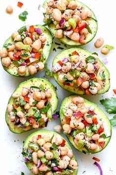 stuffed avocados with chickpeas and garbanzo salad on top are ready to be eaten