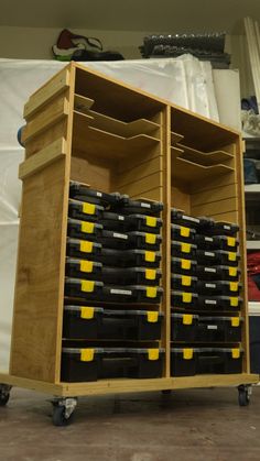 a large wooden cart filled with lots of drawers