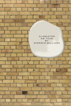 a brick wall with a sign on it that says, abaster wood and sherri williams