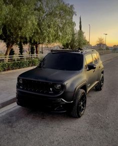 the jeep is parked on the side of the road