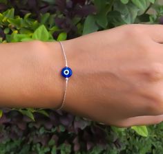 "Simple. Chic. Minimalist™ A perfectly dainty Blue Evil Eye is hanging on a delicate feminine Sterling silver chain. Evil Eye measures 8mm. Also available with 14K Gold filled / 14K Rose gold filled chain. Model is wearing 6.5\" length ❤️ Personalize it! Add a tiny letter charm to the clasp- https://www.etsy.com/listing/240726946/add-a-personalized-letter-charm?ref=shop_home_active_1 I can add a beautiful wire wrapped tiny white fresh water pearl to the clasp. Please visit this link: https://www Silver Evil Eye Jewelry, Minimalist Round Evil Eye Bracelet, Adjustable Blue Evil Eye Bracelet Nickel Free, Adjustable Nickel-free Blue Evil Eye Bracelet, Adjustable Blue Evil Eye Bracelet, Nickel Free, Minimalist Evil Eye Bracelet With Adjustable Chain As Gift, Everyday Blue Evil Eye Jewelry, Blue Eye Bracelet, Sterling Silver Evil Eye Bracelet With Adjustable Chain