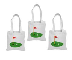 three white bags with green and red golf flags on them