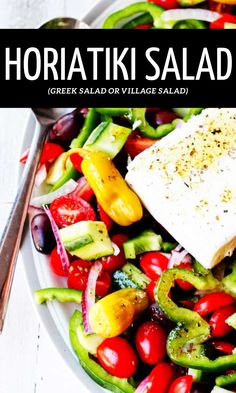 a salad with olives, tomatoes, cucumbers and feta cheese in a white bowl