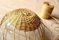 a spool of twine sitting on top of a table