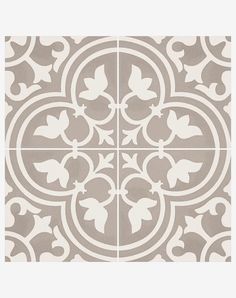 a white and grey tile with four different designs