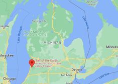 a map with a red marker on it that shows the location of michigan and detroit