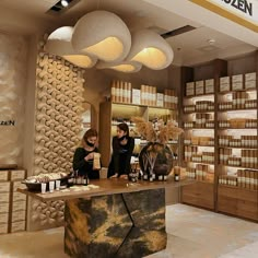 two women sitting at a counter in a store