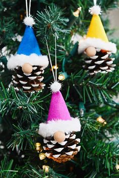 pine cone ornaments hanging from a christmas tree