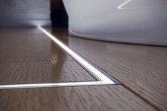 a wooden floor with a metal strip on it