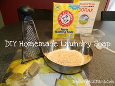 homemade laundry soap in a bowl next to a grater and scooper on a counter