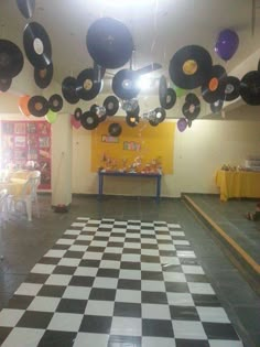 a room filled with black and white checkered flooring