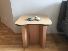 a small table with two cars on it