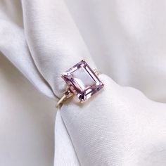 This stunning ring is set in 14k Solid Yellow Gold with Natural Pink Amethyst & Diamond with utmost precision. It is an unique statement gemstone ring for nearly every occasion and is completely hassle-free jewelry. ITEM DETAILS * Center Gem: Pink Amethyst  * Gem Size: 8X10mm * Gem Shape: Octagon (Emerald Cut) * Gem Weight: 3.14 carats * Side Gem: Diamond * Gem Size: 2mm (2pc) * Gem Shape: Round Cut * Gem Weight: 0.058 carats * Total Gem Weight: 3.20 carats * Gold Purity: 14KT * Gold Weight: 1.4 Luxury Vs Clarity Amethyst Engagement Ring, Luxury Rectangular Amethyst Engagement Ring, Elegant Yellow Gold Amethyst Ring With Diamond Accents, Fine Jewelry Amethyst Ring With Accent Stones, Elegant Yellow Gold Crystal Ring With Gemstone Accents, Fine Jewelry Amethyst Ring With Diamond Accents, Elegant Yellow Gold Amethyst Crystal Ring, Elegant Yellow Gold Crystal Amethyst Ring, Amethyst Ring In Yellow Gold With Diamond Accents