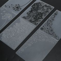 four pieces of clear plastic with black and white designs on them, all in different sizes