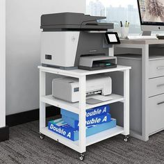 an office desk with a printer on it