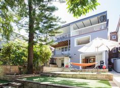 a house with a hammock in the yard