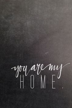 the words you are my home written on a blackboard