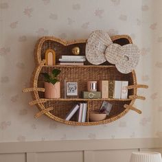 a hello kitty shelf with books and other items on it