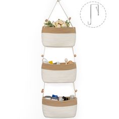 three tiered basket hanging on the wall