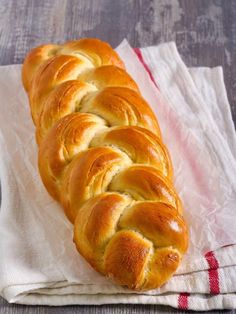 a loaf of bread sitting on top of a napkin