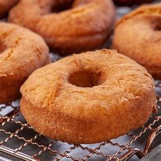 several doughnuts sitting on top of a cooling rack