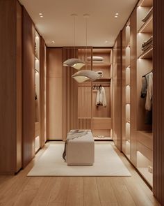 a bedroom with wooden walls and white rugs on the floor, along with hanging lights