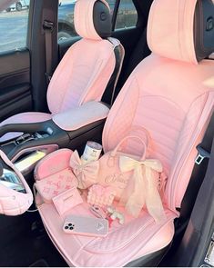 the interior of a car with baby items in it