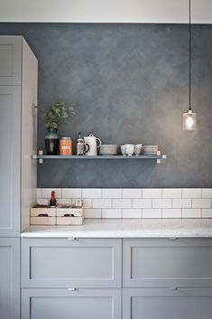 the instagram page for instagram com shows an image of a kitchen with blue walls and