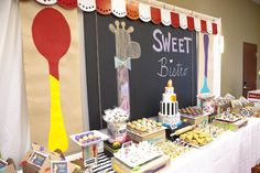 a dessert table filled with lots of treats