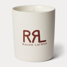 a white candle holder with the word ralph lauren printed on it in red