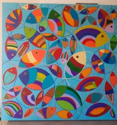 a painting with many different colored fish on it