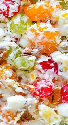 a bowl filled with fruit salad on top of a table