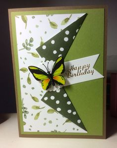 a green and white birthday card with a butterfly on it