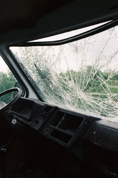 the interior of a vehicle with broken windshield