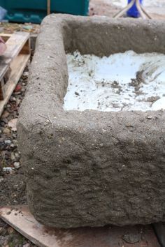 a large cement block sitting on top of a wooden table