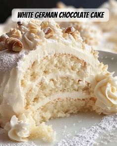 a close up of a slice of cake on a plate with the words white german chocolate cake