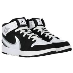 Black and white Jordan 1 Mid Easyon trainers for boys and girls by Nike. Made from soft premium leather and canvas, they have a wide, flexible collar easily bends over the heel, allowing to slip into these trainers without adjusting the laces. They feature the iconic Air Jordan "Wings" logo on the side and the Jumpman logo graces the tongue.#jordan1mid #nikekids #airjordantrainers #sneakerheads White Jordan 1, Black And White Jordans, Black White Jordans, Jordan Wings, Jumpman Logo, Wings Logo