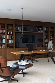 a living room filled with furniture and bookshelves