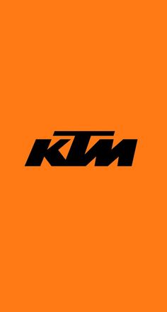 an orange background with the word ktm in black and white on top of it