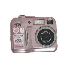 a pink digital camera sitting on top of a white surface