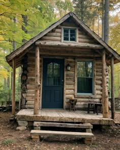 a small log cabin sits in the woods