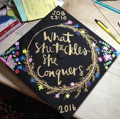 a graduation cap that says what she teaches the conquers