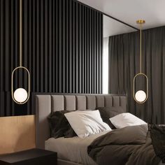 a bedroom with black and white striped walls, two hanging lights over the headboard