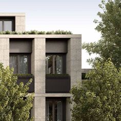 an apartment building with balconies and plants growing on the balconyes, in front of some trees